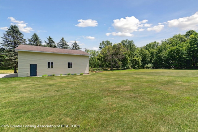 6252 N River Hwy, Grand Ledge, MI 48837 - view of green lawn featuring an outdoor structure