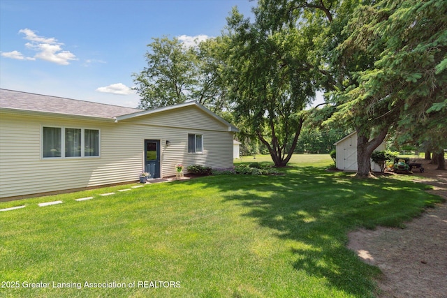 6252 N River Hwy, Grand Ledge, MI 48837 - view of grassy yard featuring a storage shed