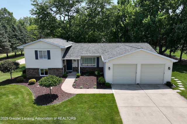 6252 N River Hwy, Grand Ledge, MI 48837 - split level home featuring a shingled roof, driveway, a front lawn, brick siding, and a garage