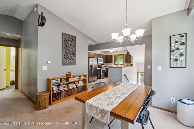 5041 E Willoughby Rd Unit 7, Holt, MI 48842 - dining space with a chandelier, light carpet, and vaulted ceiling