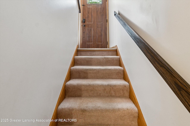 5041 E Willoughby Rd Unit 7, Holt, MI 48842 - stairs featuring carpet flooring