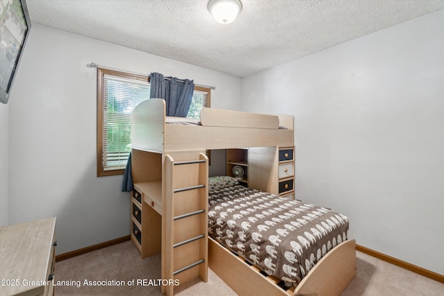 5041 E Willoughby Rd Unit 7, Holt, MI 48842 - bedroom featuring carpet flooring and a textured ceiling