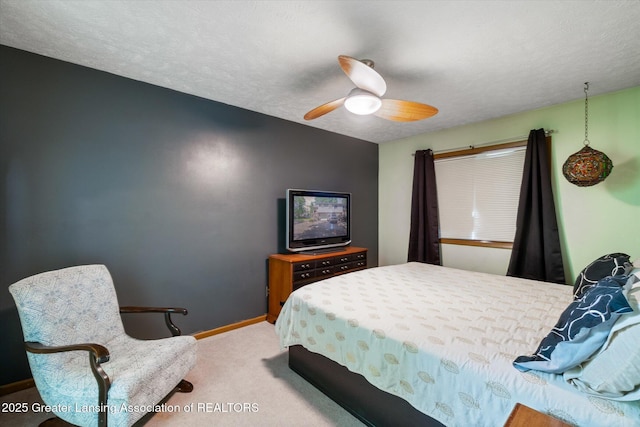 5041 E Willoughby Rd Unit 7, Holt, MI 48842 - bedroom featuring carpet floors, ceiling fan, and a textured ceiling