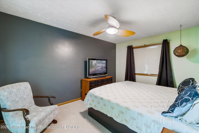 5041 E Willoughby Rd Unit 7, Holt, MI 48842 - bedroom with carpet floors and ceiling fan