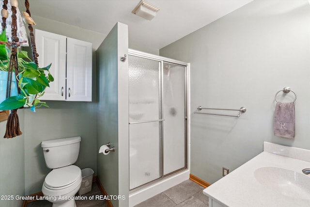 5041 E Willoughby Rd Unit 7, Holt, MI 48842 - bathroom with a shower stall, vanity, and tile patterned floors