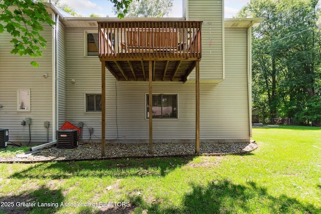 5041 E Willoughby Rd Unit 7, Holt, MI 48842 - back of property featuring a lawn and a deck