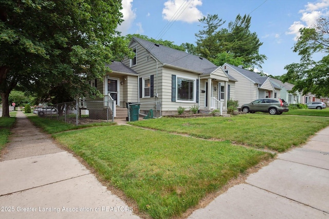 1424 Woodbine Ave, Lansing, MI 48910 - bungalow with roof with shingles