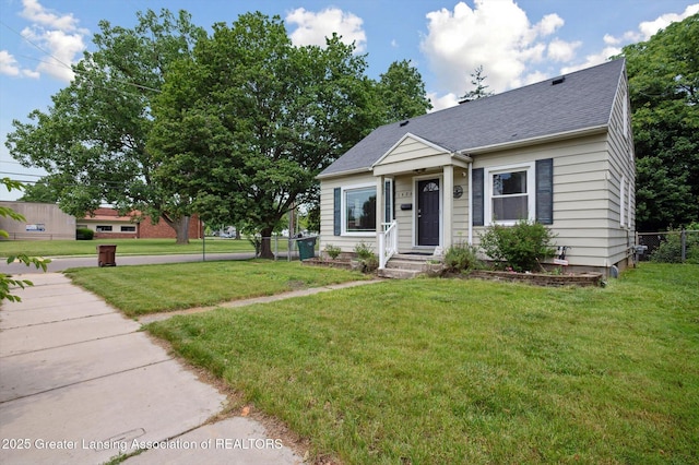1424 Woodbine Ave, Lansing, MI 48910 - view of front facade with roof with shingles