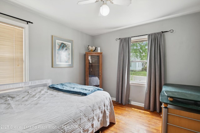 1424 Woodbine Ave, Lansing, MI 48910 - bedroom with light wood-style flooring and a ceiling fan