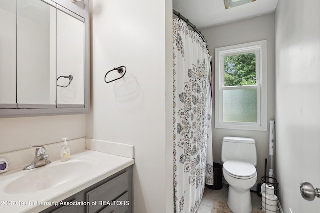 1424 Woodbine Ave, Lansing, MI 48910 - full bath with vanity, tile patterned floors, and curtained shower