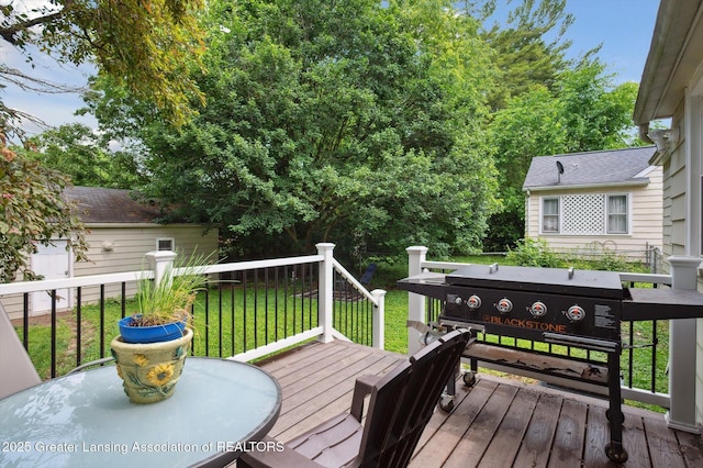1424 Woodbine Ave, Lansing, MI 48910 - wooden terrace featuring a lawn and grilling area