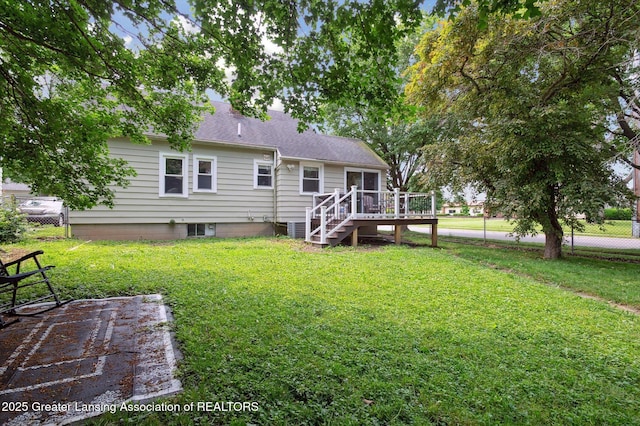 1424 Woodbine Ave, Lansing, MI 48910 - back of property featuring a deck and stairs