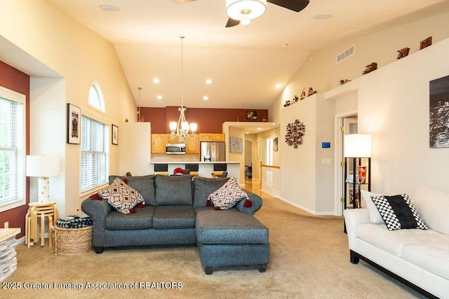 4001 Sierra Hts, Holt, MI 48842 - living area featuring light carpet, a chandelier, ceiling fan, and high vaulted ceiling