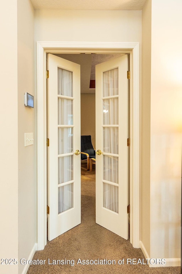 4001 Sierra Hts, Holt, MI 48842 - corridor featuring carpet floors and french doors