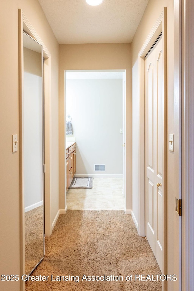 4001 Sierra Hts, Holt, MI 48842 - hall featuring carpet floors and baseboards