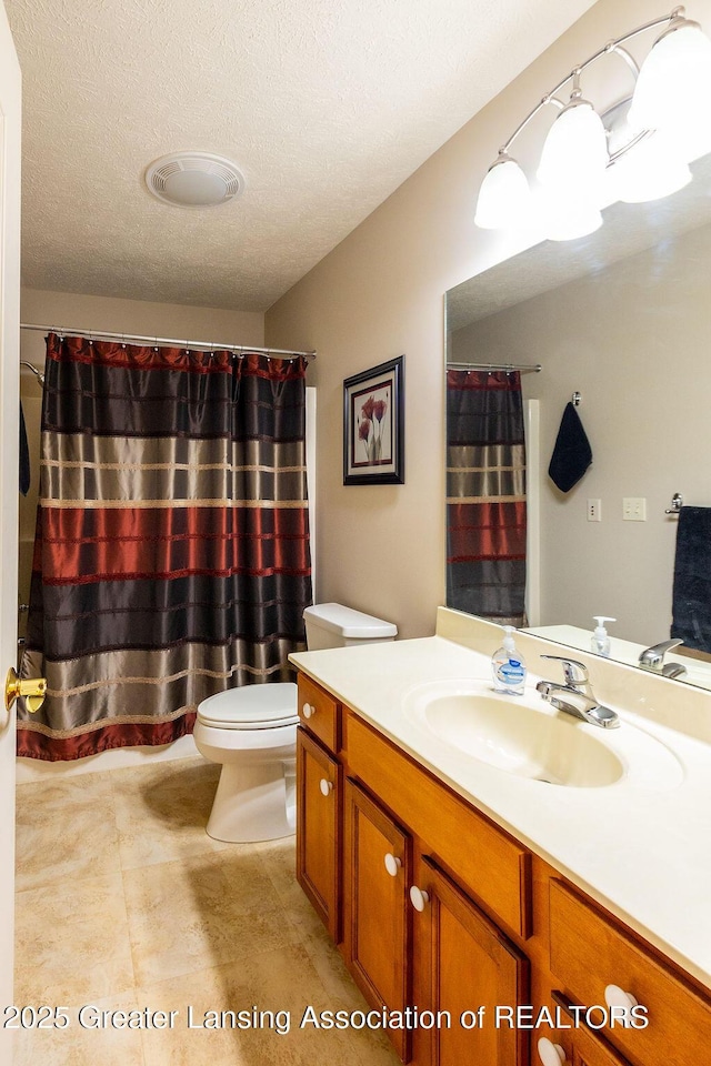 4001 Sierra Hts, Holt, MI 48842 - bathroom featuring vanity, tile patterned flooring, a textured ceiling, and a shower with shower curtain