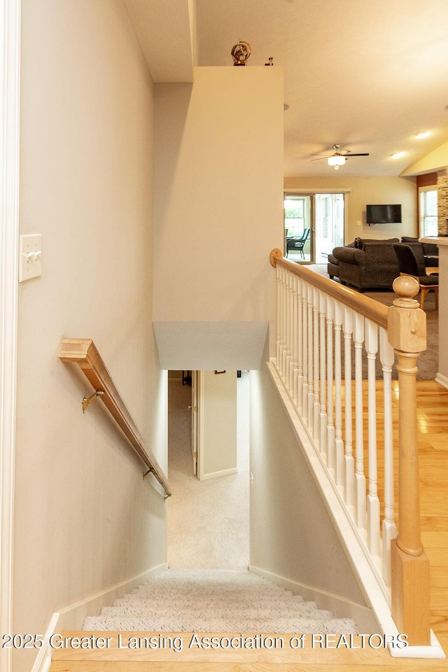 4001 Sierra Hts, Holt, MI 48842 - stairway featuring baseboards and a ceiling fan