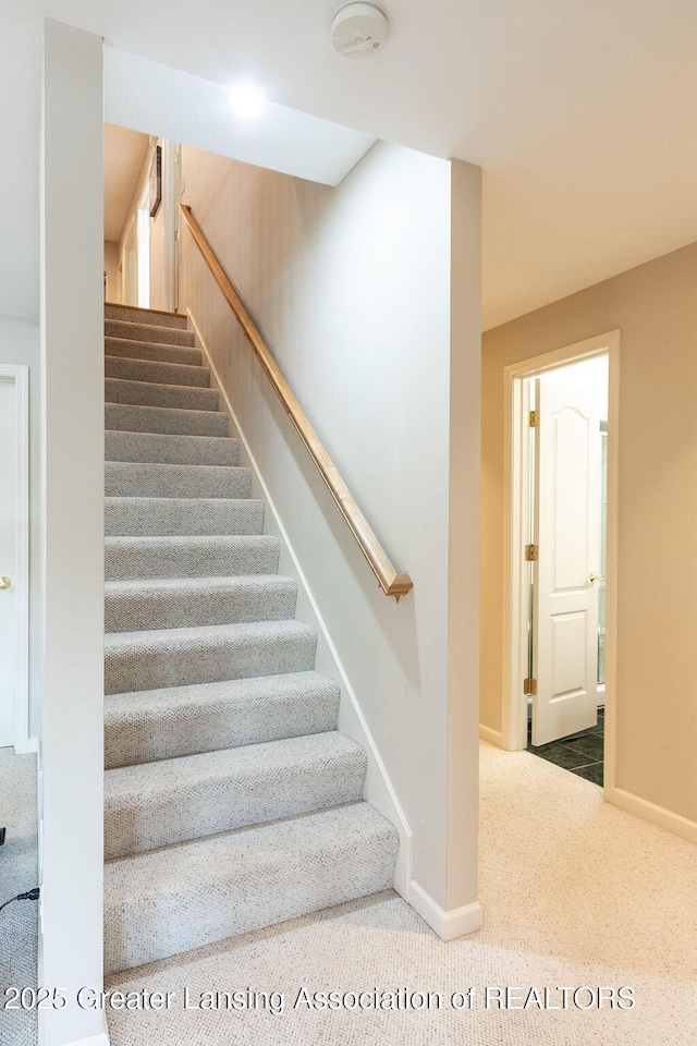 4001 Sierra Hts, Holt, MI 48842 - staircase with carpet flooring and baseboards