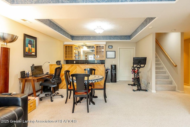 4001 Sierra Hts, Holt, MI 48842 - carpeted dining area with stairway, bar area, and a raised ceiling