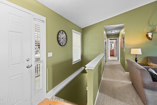 3913 Danbridge Dr, Lansing, MI 48906 - hallway with an upstairs landing and carpet