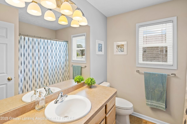 3913 Danbridge Dr, Lansing, MI 48906 - full bath featuring vanity, tile patterned flooring, and a shower with curtain