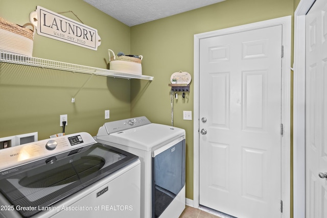 3913 Danbridge Dr, Lansing, MI 48906 - washroom with independent washer and dryer and tile patterned floors