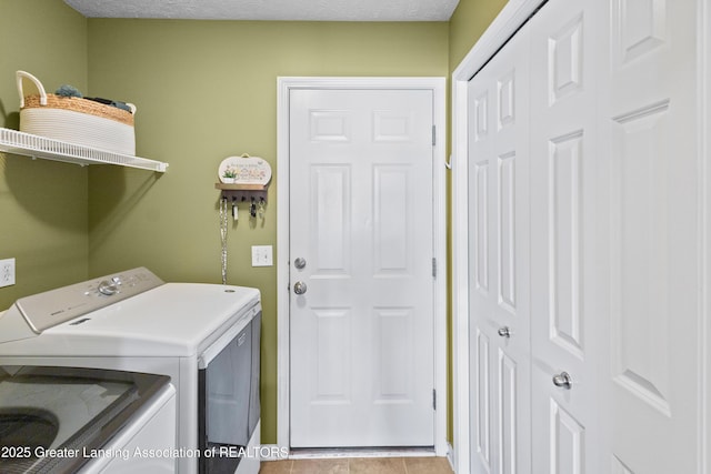 3913 Danbridge Dr, Lansing, MI 48906 - laundry room with independent washer and dryer and light tile patterned floors