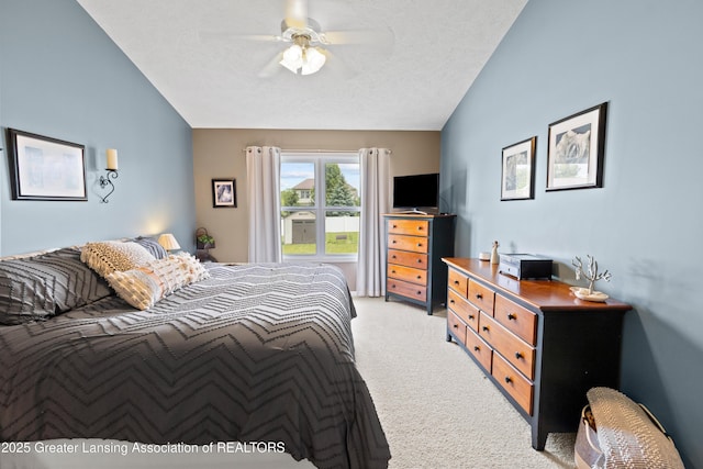 3913 Danbridge Dr, Lansing, MI 48906 - bedroom featuring light colored carpet, ceiling fan, a textured ceiling, and vaulted ceiling
