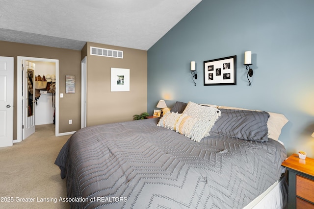 3913 Danbridge Dr, Lansing, MI 48906 - bedroom featuring carpet, a spacious closet, and lofted ceiling