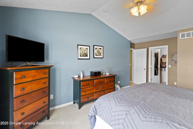 3913 Danbridge Dr, Lansing, MI 48906 - bedroom featuring lofted ceiling, a walk in closet, light colored carpet, and a ceiling fan