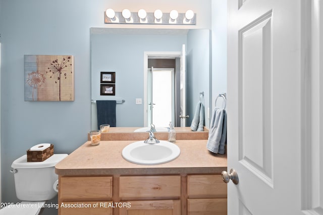 3913 Danbridge Dr, Lansing, MI 48906 - bathroom featuring vanity and toilet