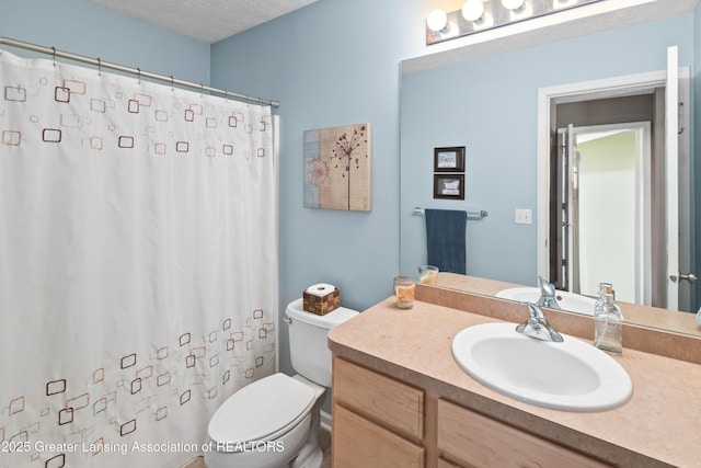 3913 Danbridge Dr, Lansing, MI 48906 - bathroom with vanity, a textured ceiling, and a shower with shower curtain
