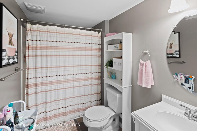 3913 Danbridge Dr, Lansing, MI 48906 - full bath featuring vanity and a shower with shower curtain