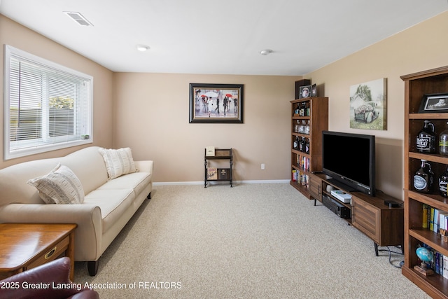 3913 Danbridge Dr, Lansing, MI 48906 - carpeted living room featuring baseboards