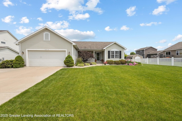 3913 Danbridge Dr, Lansing, MI 48906 - view of front of home with concrete driveway and an attached garage