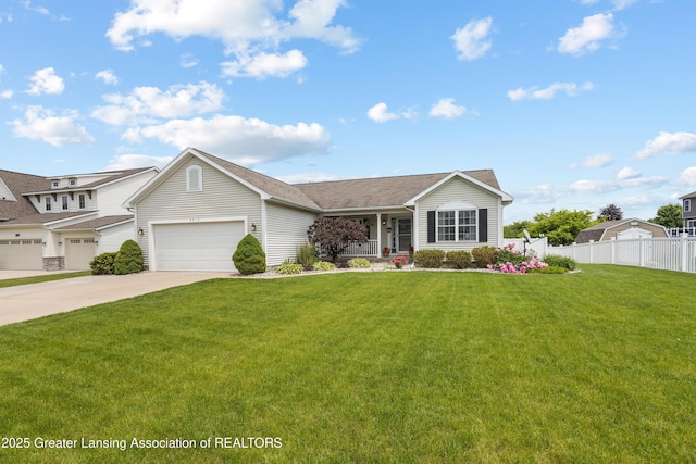 3913 Danbridge Dr, Lansing, MI 48906 - view of front facade with a porch, driveway, and a garage