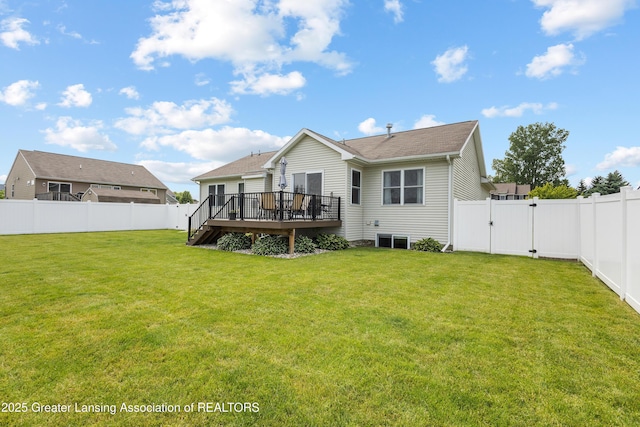 3913 Danbridge Dr, Lansing, MI 48906 - back of property with a fenced backyard, a deck, a gate, and roof with shingles