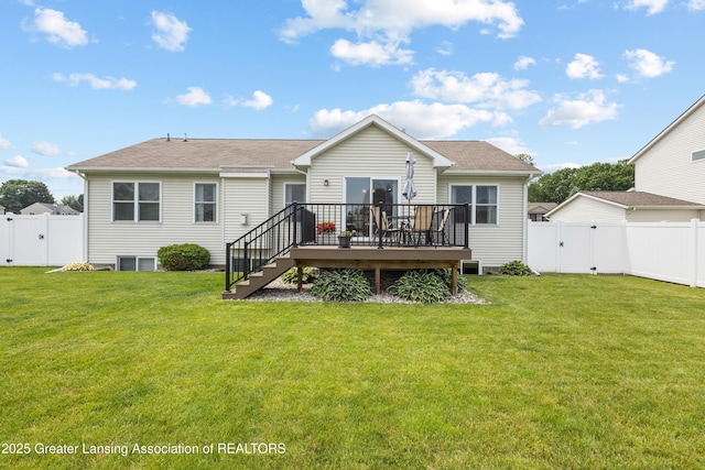 3913 Danbridge Dr, Lansing, MI 48906 - rear view of house featuring a gate, a deck, a fenced backyard, stairs, and roof with shingles