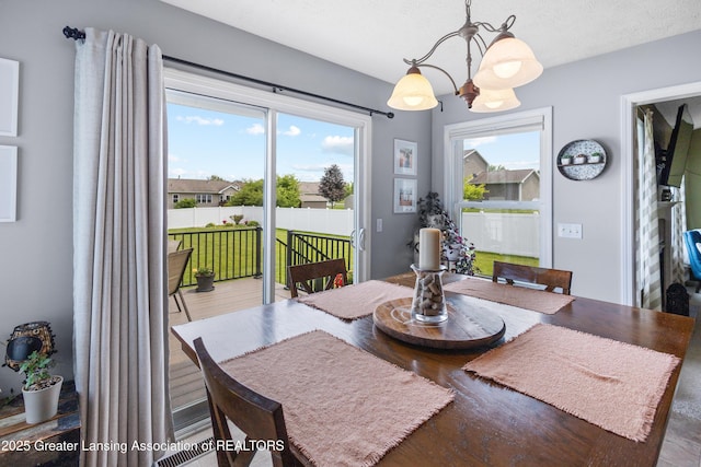 3913 Danbridge Dr, Lansing, MI 48906 - dining area with a chandelier and wood finished floors
