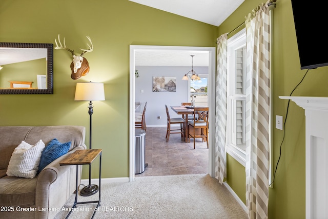 3913 Danbridge Dr, Lansing, MI 48906 - hall featuring a chandelier, lofted ceiling, and carpet floors