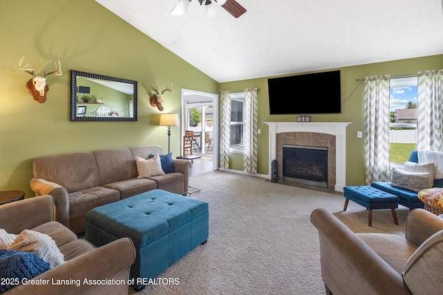 3913 Danbridge Dr, Lansing, MI 48906 - carpeted living room featuring a ceiling fan, a fireplace with flush hearth, and lofted ceiling
