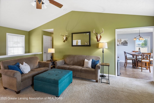 3913 Danbridge Dr, Lansing, MI 48906 - living room featuring lofted ceiling, ceiling fan, healthy amount of natural light, and carpet