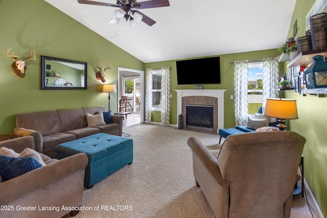 3913 Danbridge Dr, Lansing, MI 48906 - living area with healthy amount of natural light, carpet, a fireplace with flush hearth, a ceiling fan, and vaulted ceiling