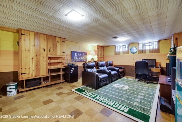 425 S Holmes St, Lansing, MI 48912 - living area featuring concrete block wall and an office area