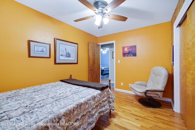 425 S Holmes St, Lansing, MI 48912 - bedroom featuring light wood finished floors and a ceiling fan