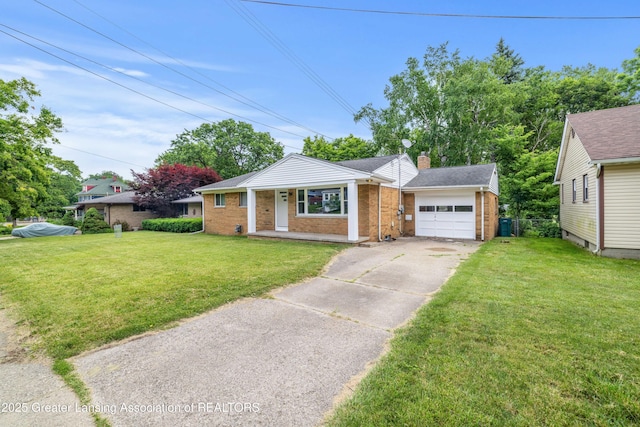 425 S Holmes St, Lansing, MI 48912 - view of front facade with brick siding, a garage, driveway, and a front yard