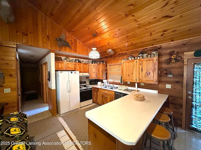 10886 SE Gillow Rd, Fife Lake, MI 49633 - kitchen with white appliances, brown cabinets, light countertops, log walls, and wood ceiling