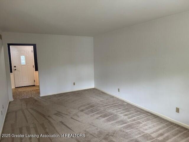 6211 Cobblers Dr, East Lansing, MI 48823 - carpeted spare room featuring baseboards