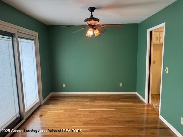 6211 Cobblers Dr, East Lansing, MI 48823 - spare room featuring healthy amount of natural light, a ceiling fan, and light wood finished floors