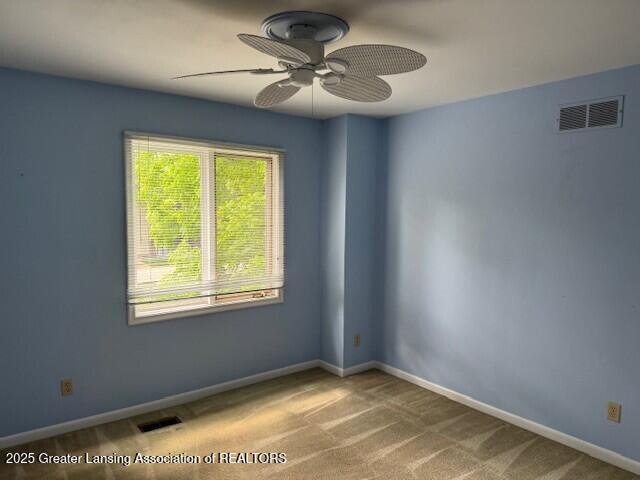 6211 Cobblers Dr, East Lansing, MI 48823 - carpeted spare room with ceiling fan and baseboards
